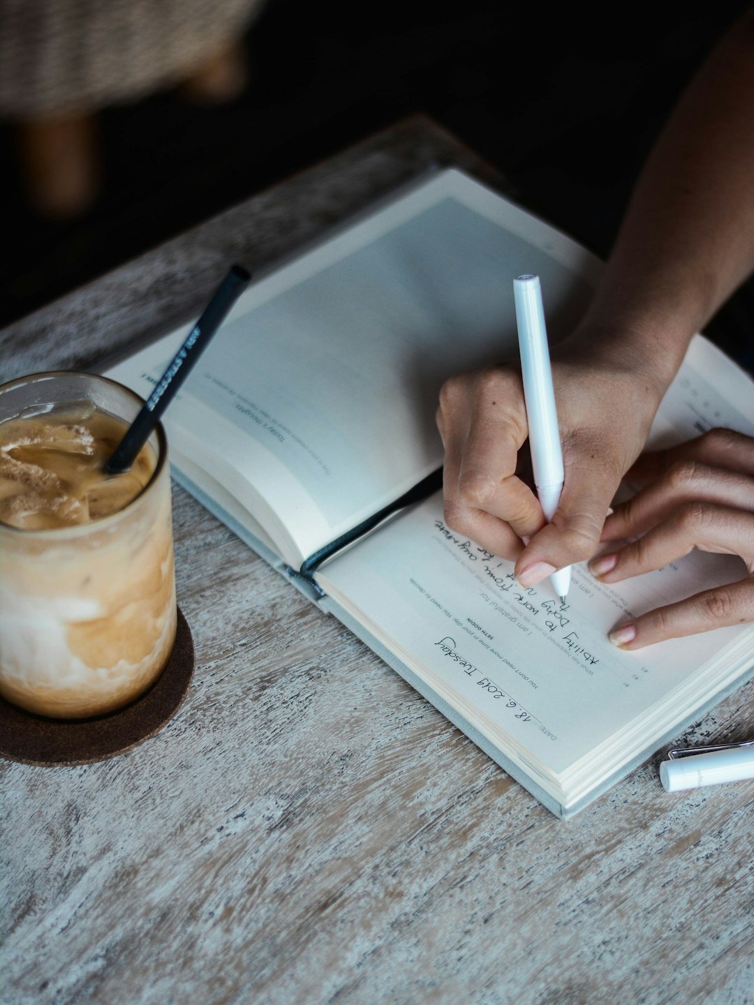 person journaling thoughts